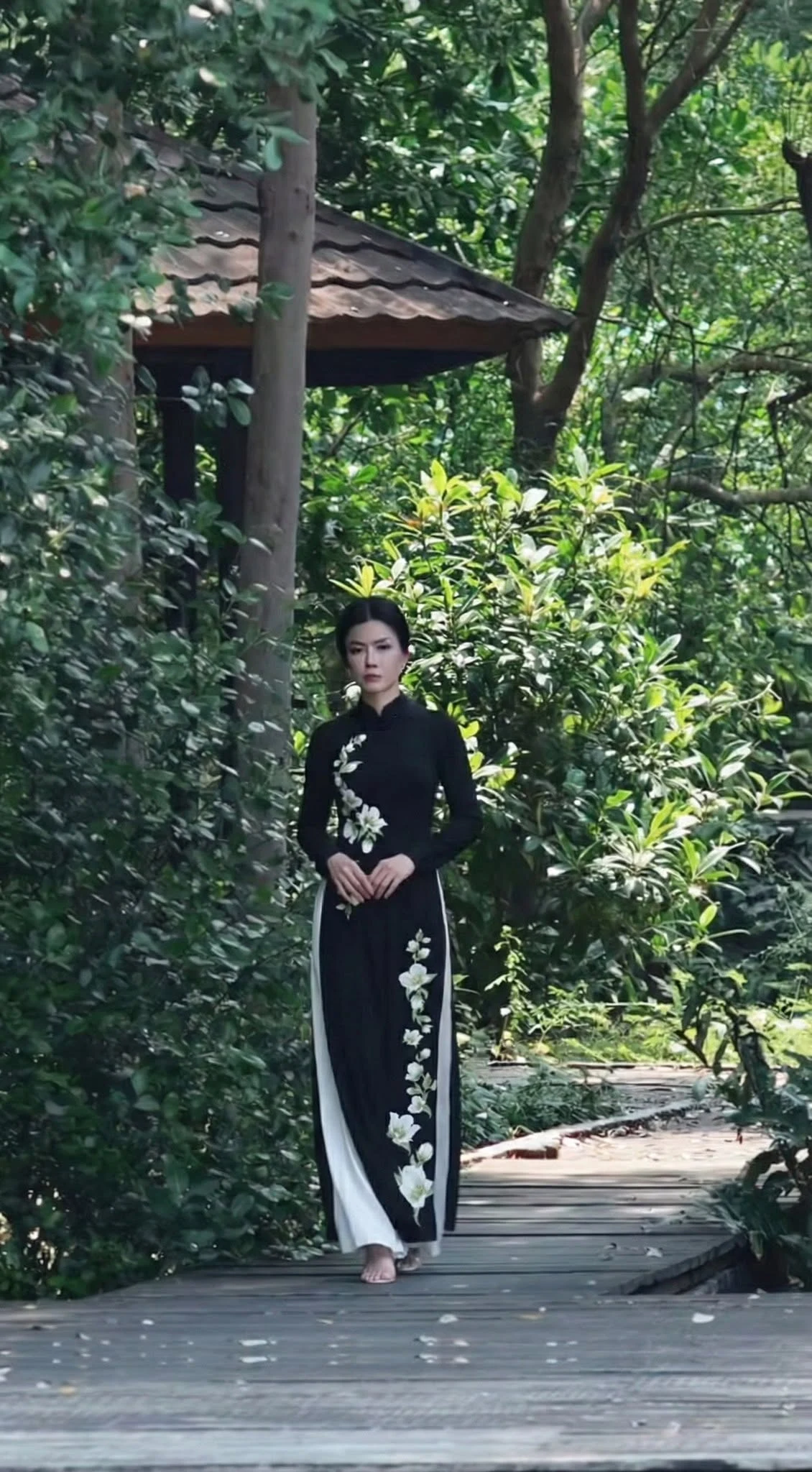 Black Áo Dài with elegant white floral embroidery animated album preview